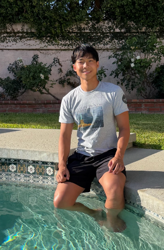 Sebastian Chen sitting at the edge of a pool
